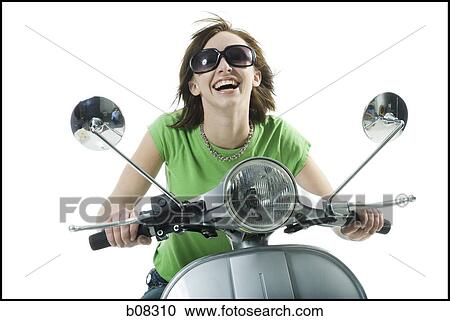 Close-up of a teenage girl riding a scooter View Large Photo Image Stock Image - Close-up of a teenage girl riding a scooter. Fotosearch