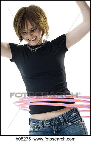 Close-up of a teenage girl spinning hula hoops around her waist View Large Photo Image Stock Photography - Close-up of a teenage girl spinning hula hoops around her waist. Fotosearch