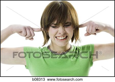 Close-up of a teenage girl with her fingers in her ears View Large Photo Image Stock Image - Close-up of a teenage girl with her fingers in her ears. Fotosearch
