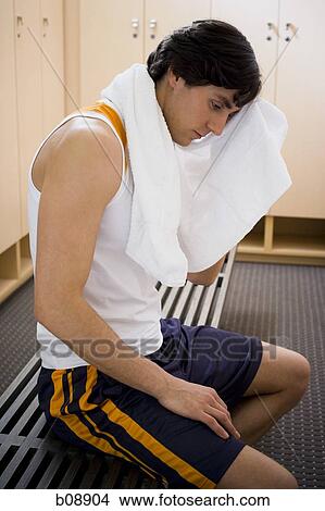 Close-up of a young man rubbing his head with a towel View Large Photo Image Picture - Close-up of a young man rubbing his head with a towel. Fotosearch