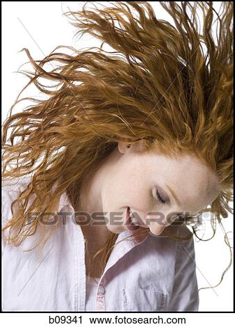 Close-up of a young woman smiling View Large Photo Image Stock Image - Close-up of a young woman smiling. Fotosearch