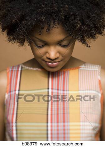 Close-up of a young woman with her eyes closed View Large Photo Image Stock Photo - Close-up of a young woman with her eyes closed. Fotosearch