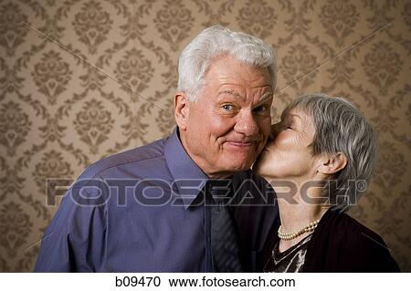 Close-up of an elderly woman kissing an elderly man View Large Photo Image Stock Image - Close-up of an elderly woman kissing an elderly man. Fotosearch