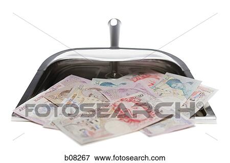 Close-up of British pounds in a dustpan View Large Photo Image Stock Photo - Close-up of British pounds in a dustpan. Fotosearch