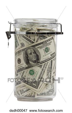 Close-up of dollar bills in a jar View Large Photo Image Stock Photo - Close-up of dollar bills in a jar. Fotosearch