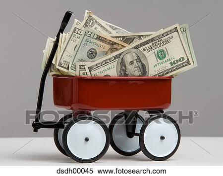 Close-up of dollar bills in a toy wagon View Large Photo Image Stock Photography - Close-up of dollar bills in a toy wagon. Fotosearch