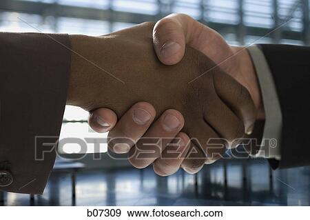 Close-up of handshake View Large Photo Image Stock Photo - Close-up of handshake. Fotosearch