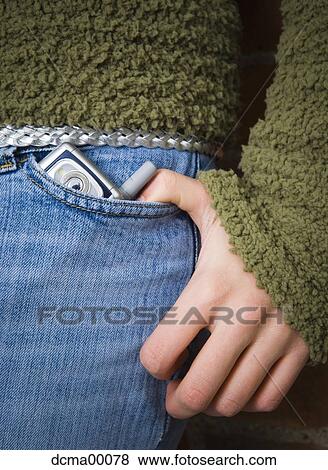 Close-up of pocket with cell phone and hand View Large Photo Image Stock Photo - Close-up of pocket with cell phone and hand. Fotosearch