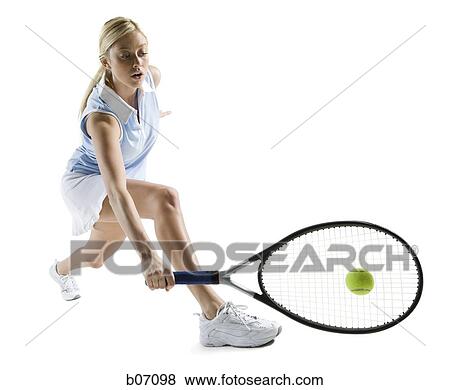 Close-up of tennis player hitting ball View Large Photo Image Stock Photo - Close-up of tennis player hitting ball. Fotosearch