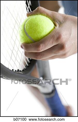 Close-up of tennis player serving ball View Large Photo Image Stock Image - Close-up of tennis player serving ball. Fotosearch