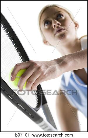 Close-up of tennis player serving ball View Large Photo Image Stock Image - Close-up of tennis player serving ball. Fotosearch