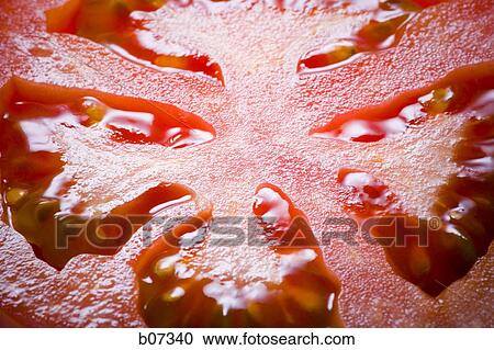 Close-up of tomato slice View Large Photo Image Stock Image - Close-up of tomato slice. Fotosearch