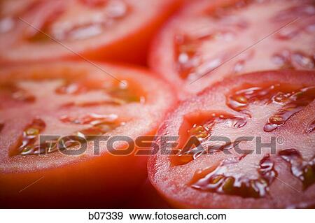 Close-up of tomato slices View Large Photo Image Stock Photo - Close-up of tomato slices. Fotosearch