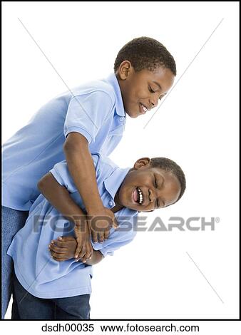 Close-up of two boys playing View Large Photo Image Stock Photography - Close-up of two boys playing. Fotosearch