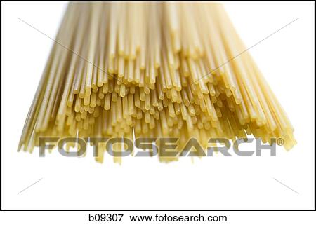 Close-up of uncooked spaghetti against a white background View Large Photo Image Stock Photo - Close-up of uncooked spaghetti against a white background. Fotosearch
