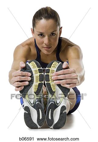 Close-up of woman athlete stretching legs View Large Photo Image Stock Image - Close-up of woman athlete stretching legs. Fotosearch