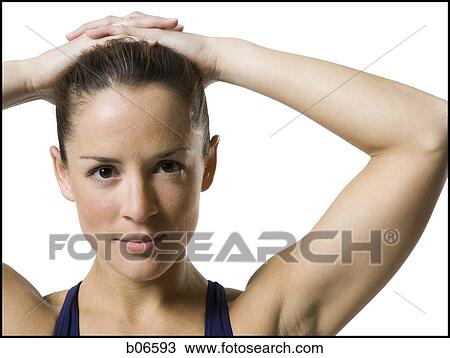Close-up of woman athlete with hands on head View Large Photo Image Stock Image - Close-up of woman athlete with hands on head. Fotosearch