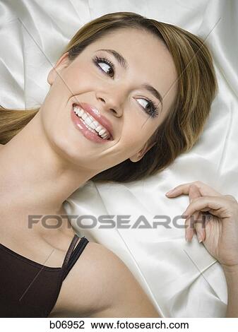 Stock Image - Close-up of woman in reclined position. Fotosearch