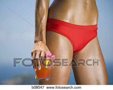 Close-up of woman in red bikini View Large Photo Image Stock Photo - Close-up of woman in red bikini. Fotosearch