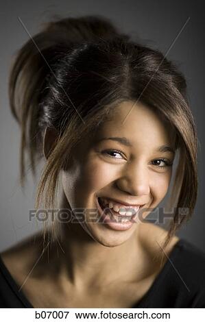 Close-up of woman laughing View Large Photo Image Stock Photo - Close-up of woman laughing. Fotosearch