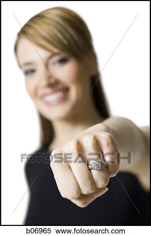 Close up of woman wearing ring View Large Photo Image Stock Photography - Close up of woman wearing ring. Fotosearch