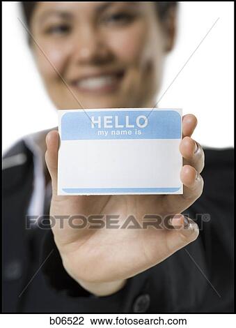 Stock Image - Close-up of woman with blank name tag. Fotosearch