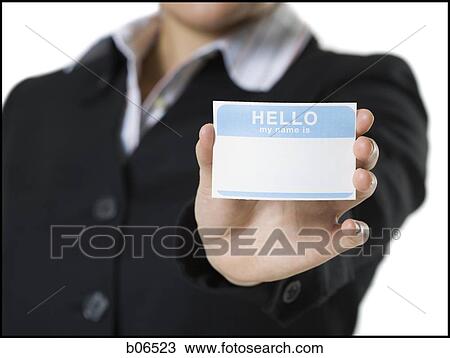 Stock Image - Close-up of woman with blank name tag. Fotosearch