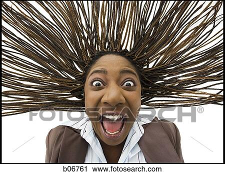 Close-up of woman with braided hair and wild expression View Large Photo Image Stock Image - Close-up of woman with braided hair and wild expression. Fotosearch