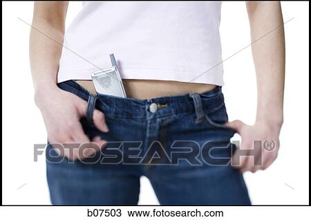 Close-up of woman's hips with cell phone tucked in waist View Large Photo Image Stock Image - Close-up of woman's hips with cell phone tucked in waist. Fotosearch