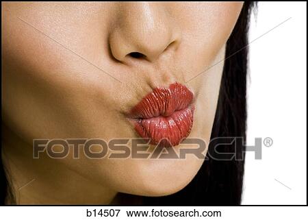 Closeup of female mouth with red lipstick puckering View Large Photo Image Stock Photo - Closeup of female mouth with red lipstick puckering. Fotosearch