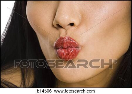 Closeup of female mouth with red lipstick puckering View Large Photo Image Stock Photograph - Closeup of female mouth with red lipstick puckering. Fotosearch