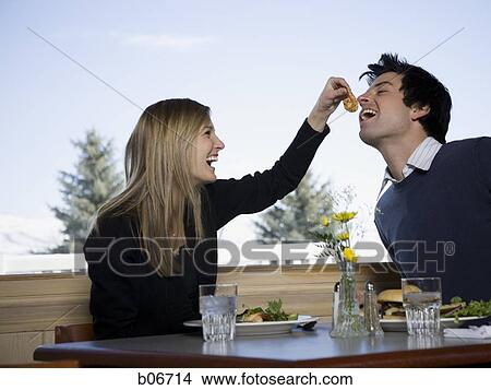 Couple eating at fast food restaurant View Large Photo Image Picture - Couple eating at fast food restaurant. Fotosearch