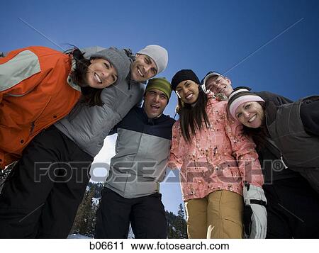 Stock Image - Couples grinning and posing. Fotosearch
