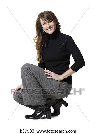Stock Photo - Crouching woman. Fotosearch