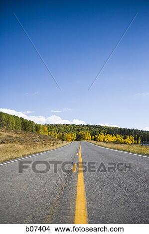 Deserted two lane highway View Large Photo Image Picture - Deserted two lane highway. Fotosearch