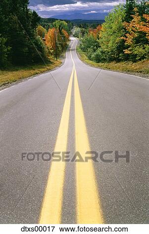 Stock Photo - Deserted two lane highway. Fotosearch