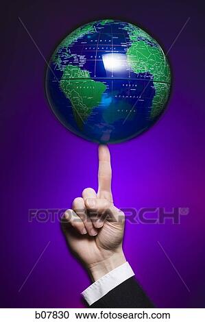 Earth globe balancing on fingertip View Large Photo Image Stock Image - Earth globe balancing on fingertip. Fotosearch