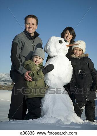 Family with snowman View Large Photo Image Stock Image - Family with snowman. Fotosearch