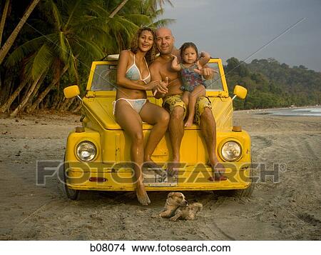 Family with young daughter at the beach View Large Photo Image Picture - Family with young daughter at the beach. Fotosearch
