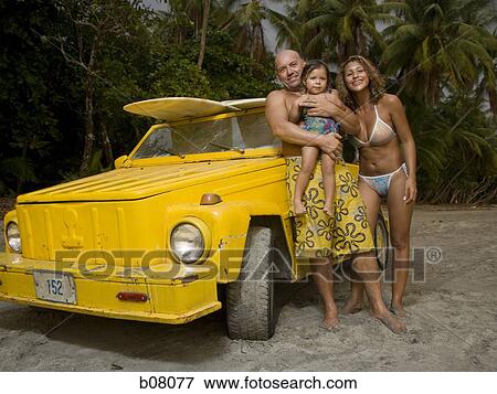 Family with young daughter at the beach View Large Photo Image Stock Photo - Family with young daughter at the beach. Fotosearch