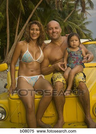 Family with young daughter at the beach View Large Photo Image Stock Photography - Family with young daughter at the beach. Fotosearch
