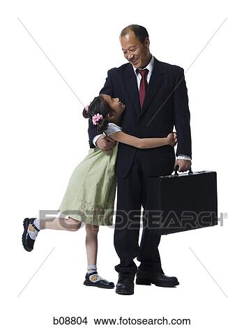 Father and his daughter looking at each other, smiling View Large Photo Image Picture - Father and his daughter looking at each other, smiling. Fotosearch