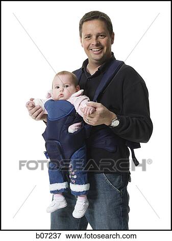 Father with baby in pouch View Large Photo Image Stock Photo - Father with baby in pouch. Fotosearch