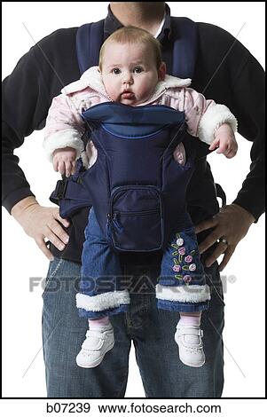 Father with baby in pouch View Large Photo Image Stock Photo - Father with baby in pouch. Fotosearch