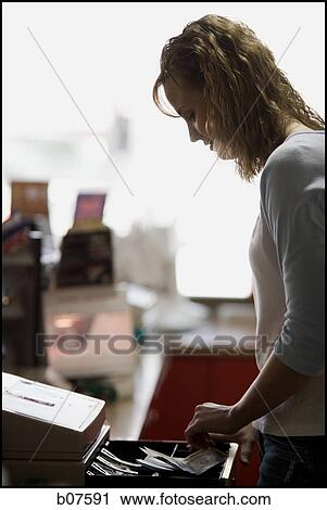 Female clerk in retail store View Large Photo Image Stock Image - Female clerk in retail store. Fotosearch