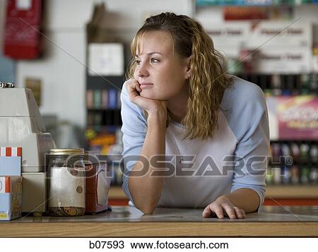 Female clerk in retail store View Large Photo Image Stock Image - Female clerk in retail store. Fotosearch