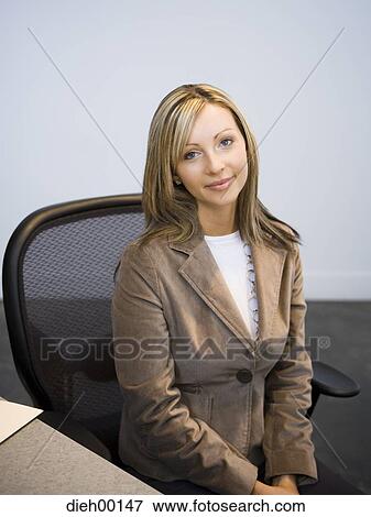 Female office worker with laptop View Large Photo Image Stock Photo - Female office worker with laptop. Fotosearch