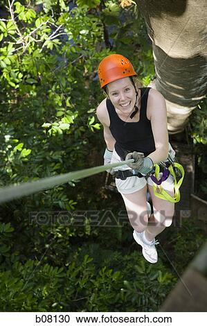 Female tree climber View Large Photo Image Stock Image - Female tree climber. Fotosearch