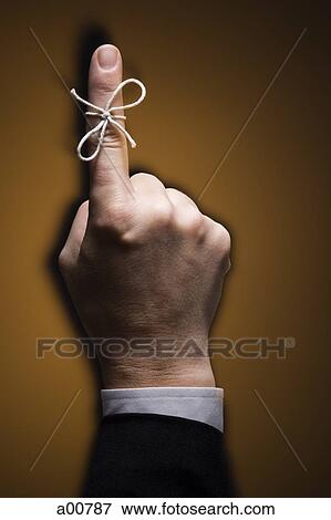 Finger with piece of string tied around it View Large Photo Image Stock Photo - Finger with piece of string tied around it. Fotosearch