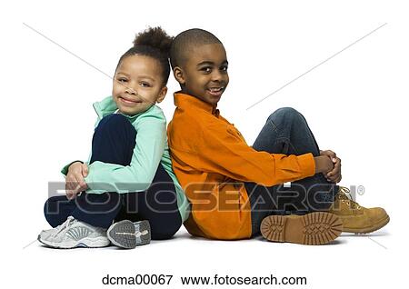 Girl and boy seated back to back View Large Photo Image Stock Photo - Girl and boy seated back to back. Fotosearch
